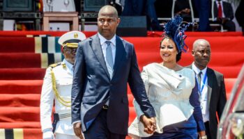 Mozambique's President-elect, Daniel Chapo, left, and his wife, Gueta Chapo, leave after the presidential inauguration ceremony in Maputo, Mozambique, Wednesday, Jan. 15, 2025. (AP Photo/Carlos Uqueio)