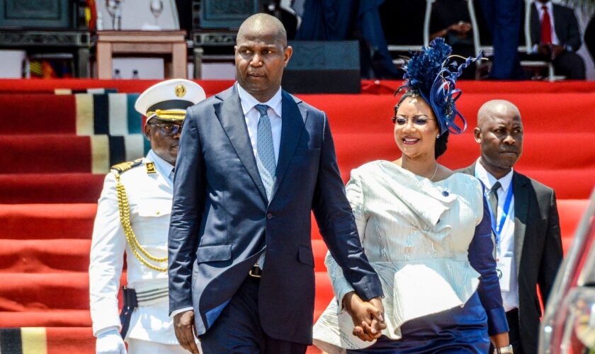 Mozambique's President-elect, Daniel Chapo, left, and his wife, Gueta Chapo, leave after the presidential inauguration ceremony in Maputo, Mozambique, Wednesday, Jan. 15, 2025. (AP Photo/Carlos Uqueio)