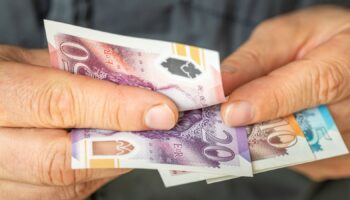 A file picture of someone counting money. Pic: iStock