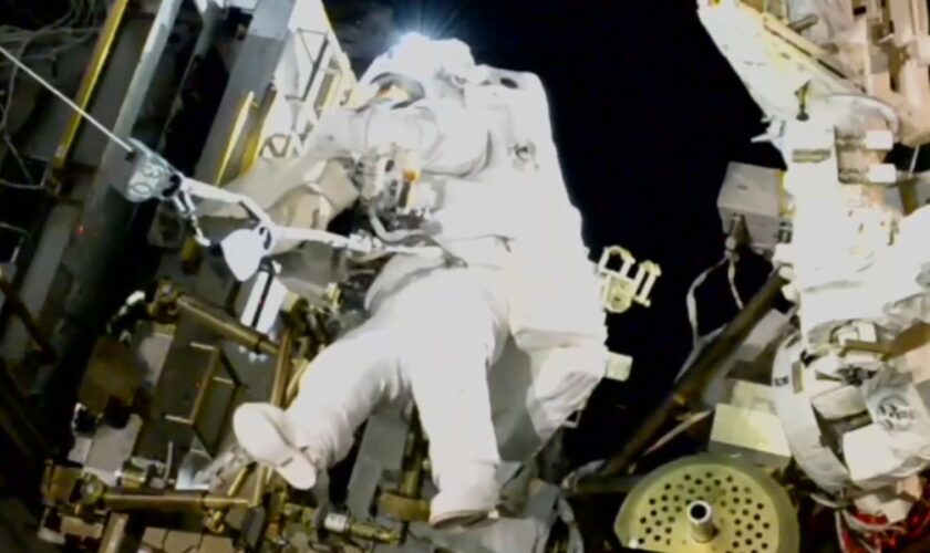 NASA's stuck astronaut steps out for spacewalk