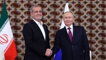 Russian President Vladimir Putin, right, and Iranian President Masoud Pezeshkian shake hands during a meeting in Turkmenistan last year. Pic: AP