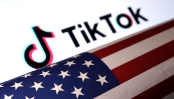 U.S. flag is placed on a TikTok logo in this illustration taken March 20, 2024. REUTERS/Dado Ruvic/Illustration