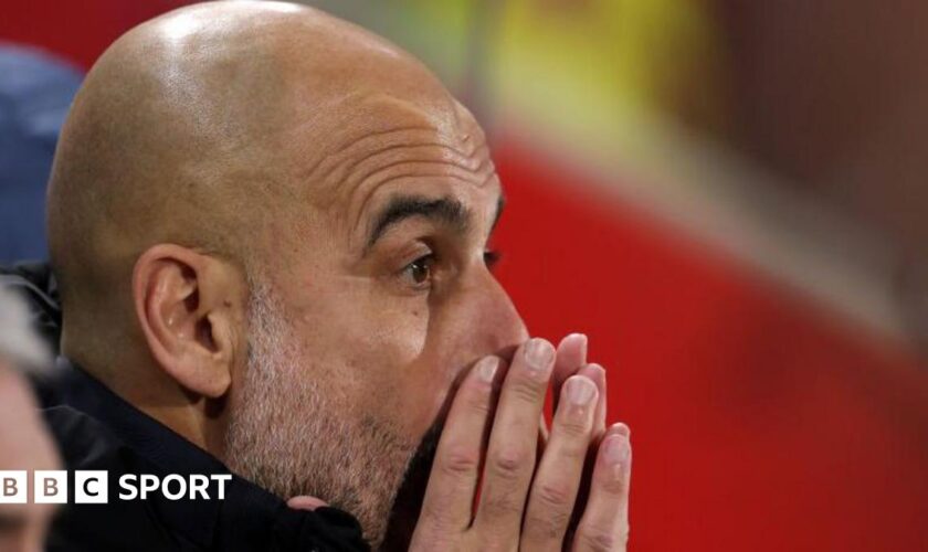 Pep Guardiola with his hands partially covering his face