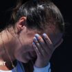 An emotional Jodie Burrage covers her face after beating Leolia Jeanjean in the Australian Open first round