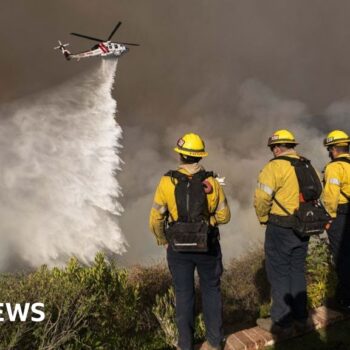 As winds pick up, LA firefighters desperately battle to contain monster inferno