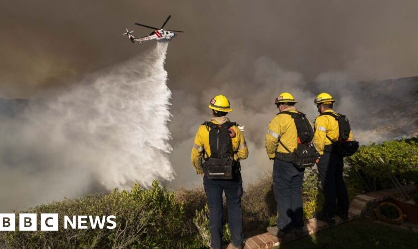 As winds pick up, LA firefighters desperately battle to contain monster inferno