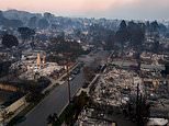 Astonishing video shows LA's scorched earth: Mile after mile of smouldering ruins of what used to be multi million dollar mansions as fires still rage out of control