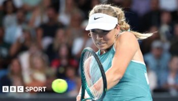 Katie Boulter hits a return at the Australian Open