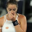 Jodie Burrage covers her face during an Australian Open second-round match against Coco Gauff