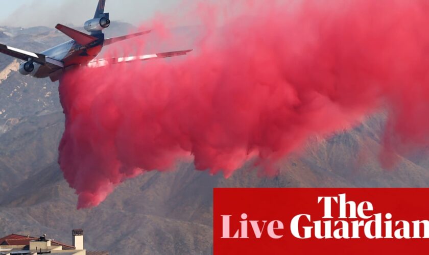 California fires live: progress made against some LA blazes but thickening smoke prompts ‘health emergency’