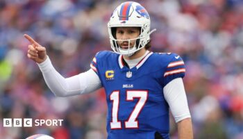 Buffalo Bills quarterback Josh Allen points to his team-mate during their Wildcard Weekend game agains the Denver Broncos