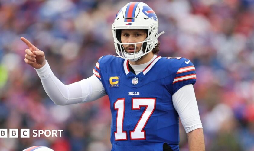 Buffalo Bills quarterback Josh Allen points to his team-mate during their Wildcard Weekend game agains the Denver Broncos