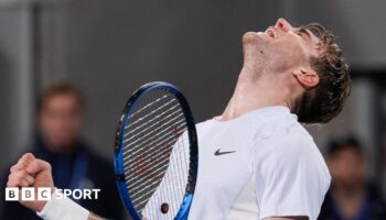 Jack Draper looks to the sky and roars after beating Aleksandar Vukic at the Australian Open