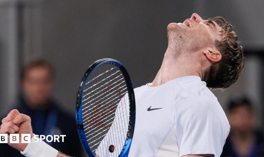 Jack Draper looks to the sky and roars after beating Aleksandar Vukic at the Australian Open