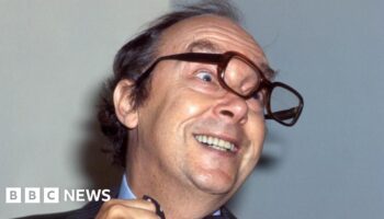 Eric Morecambe's trademark glasses sell for £20,000