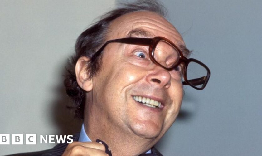 Eric Morecambe's trademark glasses sell for £20,000