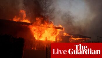 Fast-moving wildfire billowed by ‘life threatening’ windstorm sweeps southern California – live updates