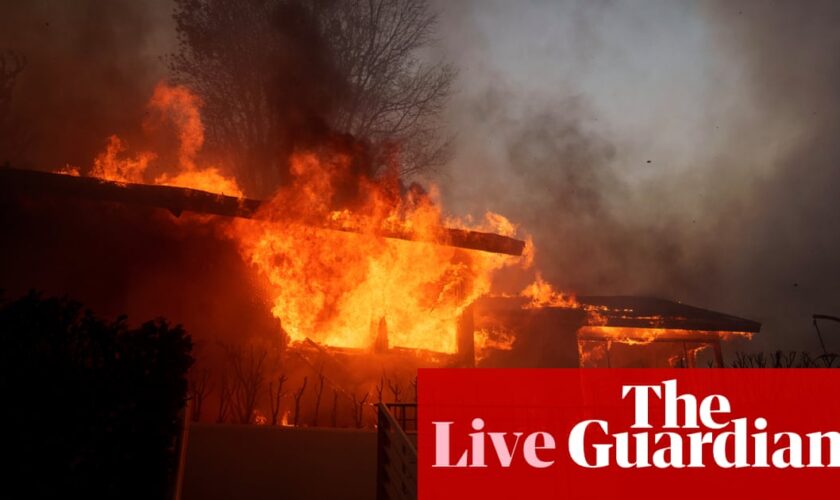 Fast-moving wildfire billowed by ‘life threatening’ windstorm sweeps southern California – live updates