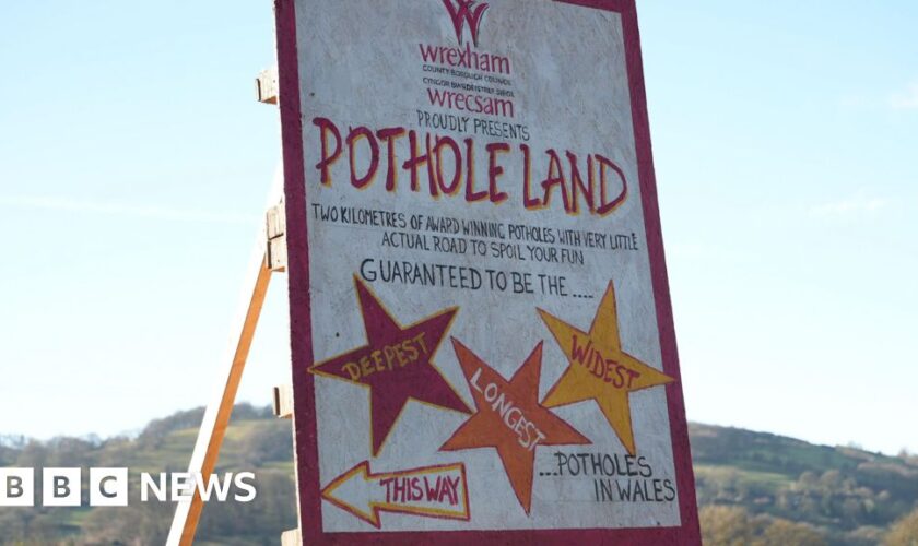 Fed up villagers turn pot holes into attraction