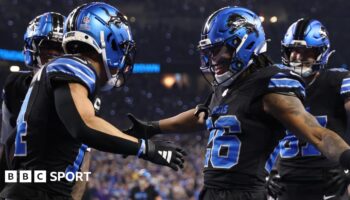 Detroit Lions players celebrate a touchdown against the Minnesota Vikings in the NFL