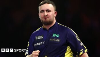 Luke Littler purses his lips during the PDC World Championship