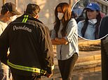 Meghan and Prince Harry comfort LA fire victims and first responders as Fox is slammed for saying 'Princess Markle' is 'hanging out with the commoners' while city continues to burn