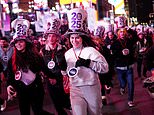 New Year's Eve washout as thousands brave freak lightning storm and torrential rain to welcome in 2025 at NYC's iconic Times Square ball drop