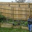 Our neighbour ruined our property after putting up a huge spiked 'privacy' fence - it's like we're prisoners in Colditz Castle