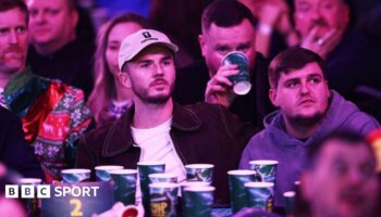 James Maddison watching darts