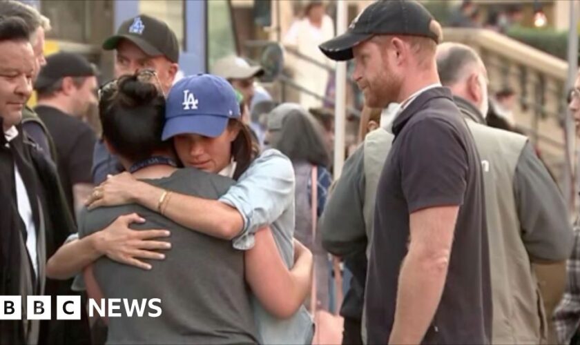 Prince Harry and Meghan hug residents in Pasadena