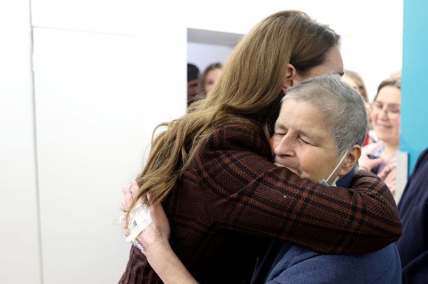 Princess Kate pictured in three touching moments as she meets fellow cancer patients