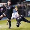 Tom Willis runs past a tackler to score a try