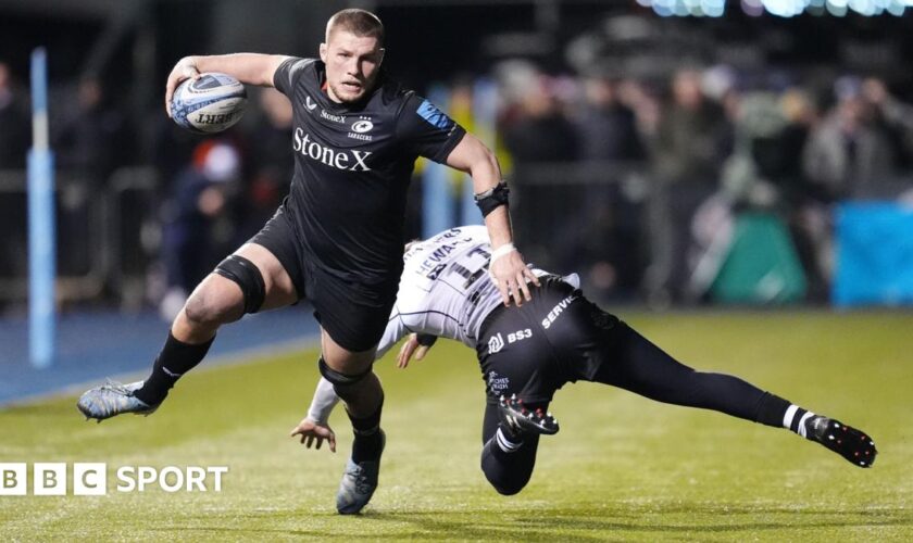 Tom Willis runs past a tackler to score a try