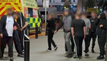 Shocking moment angry mob forces Queen Elizabeth hospital into lockdown 'threatening staff'