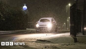 Snow and freezing rain sweep UK with amber warnings in place