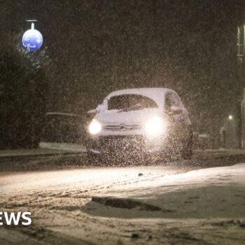 Snow and freezing rain sweep UK with amber warnings in place