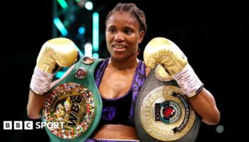 Caroline Dubois posing with the WBC and IBO belts