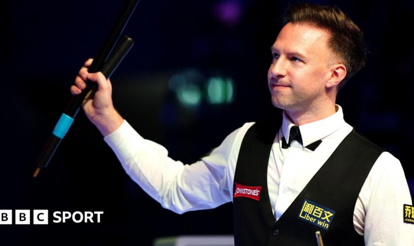 Judd Trump celebrates his quarter-final win at the Masters