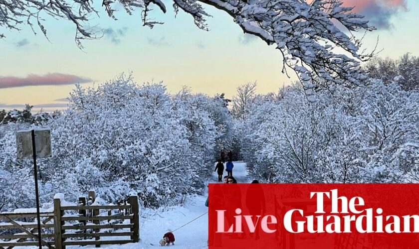 UK weather warnings remain in place as UK hit by snow and freezing rain – live updates