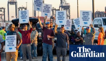 US longshoremen reach tentative deal with ports and shippers to avert strike